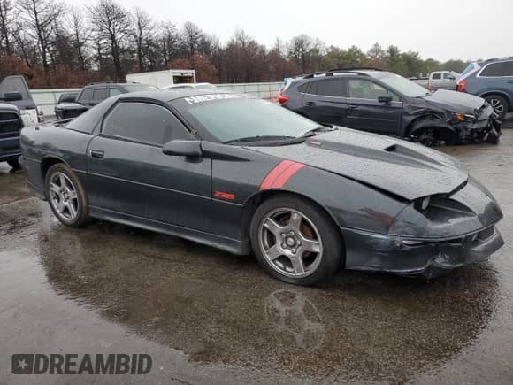 1994 Chevrolet Camaro Z28 z VIN 2G1FP22P4R2105947, wystawiony jako Copart lot #85064294 z przebiegiem 131 315 mil mil oraz Szkoda całkowita • Salvage title. Historia ofert i sprzedaży dostępna na DreamBid. Obrazek 4.