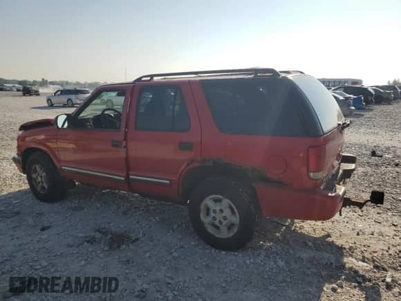 2000 Chevrolet Blazer LS with VIN 1GNDT13W5Y2280679, listed as a Copart auction lot 64712735 with Not provided miles and Salvage title. Bid and sale history available at DreamBid. Image 2.