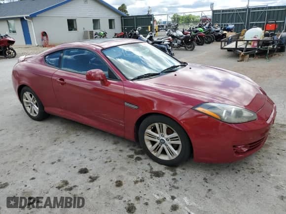 2007 Hyundai Tiburon GS with VIN KMHHM66D57U249543, listed as a Copart auction lot 54241834 with 190,951 mi miles and Salvage title. Bid and sale history available at DreamBid. Image 4.