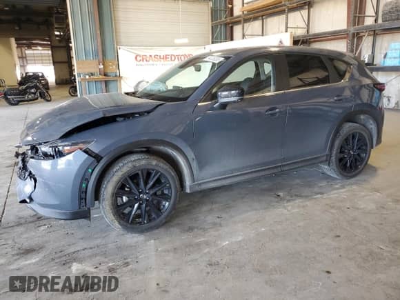 2024 Mazda CX-5 S Carbon Edition z VIN JM3KFBCL2R0408870, wystawiony jako Copart lot #64036385 z przebiegiem 19 874 mil mil oraz Szkoda całkowita • Salvage title. Historia ofert i sprzedaży dostępna na DreamBid. Obrazek 1.