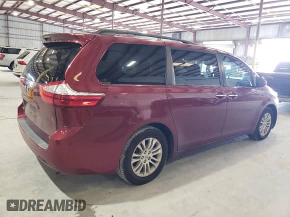 2015 Toyota Sienna XLE with VIN 5TDYK3DC8FS669402, listed as a Copart auction lot 71993775 with 187,428 mi miles and Salvage title. Bid and sale history available at DreamBid. Image 3.