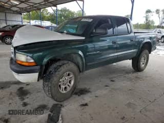 2002 Dodge Dakota SLT z VIN 1B7HG48Z82S529793, wystawiony jako Copart lot #84787935 z przebiegiem 120 211 mil mil oraz Szkoda całkowita • Salvage title. Historia ofert i sprzedaży dostępna na DreamBid. Obrazek 1.