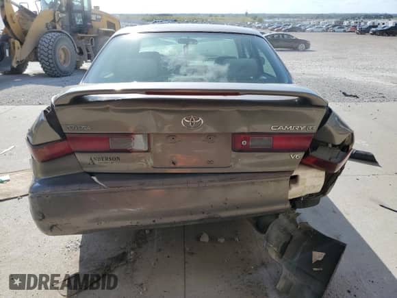 1999 Toyota Camry LE z VIN JT2BF28K2X0219943, wystawiony jako Copart lot #70005325 z przebiegiem Nie podano mil oraz Szkoda całkowita • Salvage title. Historia ofert i sprzedaży dostępna na DreamBid. Obrazek 6.