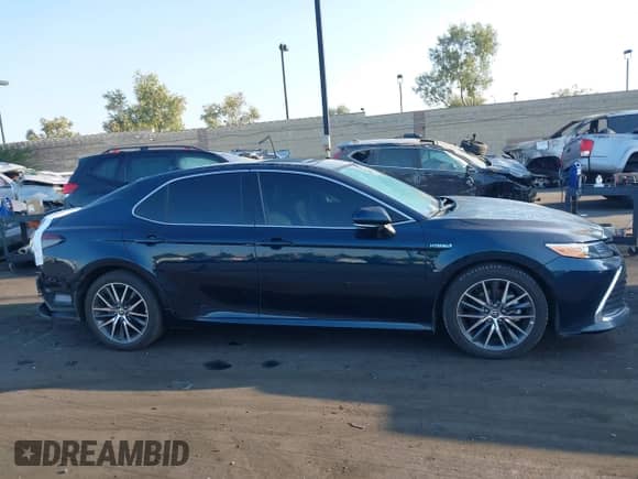 2021 Toyota Camry Hybrid XLE with VIN 4T1F31AK9MU547267, listed as a IAAI auction lot 42732726 with 106,937 mi miles and . Bid and sale history available at DreamBid. Image 14.