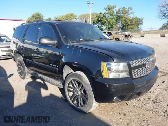 2007 Chevrolet Tahoe LTZ with VIN 1GNFK13027R249676, listed as a IAAI auction lot 43424132 with 296,751 mi miles and . Bid and sale history available at DreamBid. Image 1.