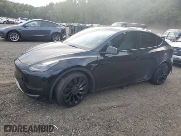 2023 Tesla Model Y Performance with VIN 7SAYGDEF0PF808883, listed as a Copart auction lot 82106605 with 22,706 mi miles and Salvage title. Bid and sale history available at DreamBid. Image 1.