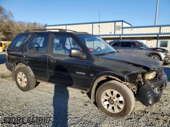 1998 Honda Passport LX with VIN 4S6CM58W7W4419247, listed as a Copart auction lot 88231175 with 194,105 mi miles and Salvage title. Bid and sale history available at DreamBid. Image 4.