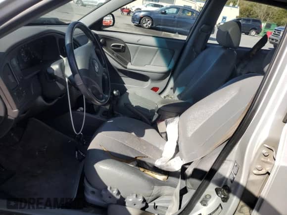 2005 Hyundai Elantra GLS with VIN KMHDN56D05U174589, listed as a Copart auction lot 87248445 with Not provided miles and Salvage title. Bid and sale history available at DreamBid. Image 7.