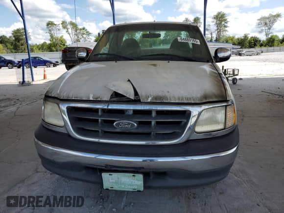 2001 Ford F-150 XL z VIN 1FTRF17W41NA93907, wystawiony jako Copart lot #64889165 z przebiegiem Nie podano mil oraz Szkoda całkowita • Salvage title. Historia ofert i sprzedaży dostępna na DreamBid. Obrazek 5.