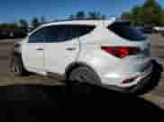 2017 Hyundai Santa Fe 2.4L z VIN 5NMZUDLB9HH010036, wystawiony jako Copart lot #87078565 z przebiegiem 81 235 mil mil oraz Szkoda całkowita • Salvage title. Historia ofert i sprzedaży dostępna na DreamBid. Obrazek 2.