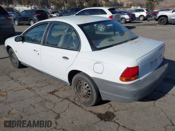 1998 Saturn SL with VIN 1G8ZG5283WZ233209, listed as a IAAI auction lot 40997373 with 240,385 mi miles and . Bid and sale history available at DreamBid. Image 3.