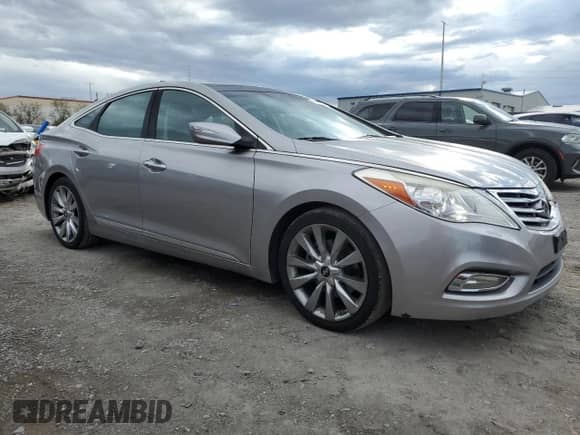 2013 Hyundai Azera с VIN KMHFH4JG8DA274824, выставлен на аукционе Copart как лот 81691625 с пробегом 119 855 миль миль и Списание • Salvage title. История ставок и продаж доступна на DreamBid. Изображение 4.