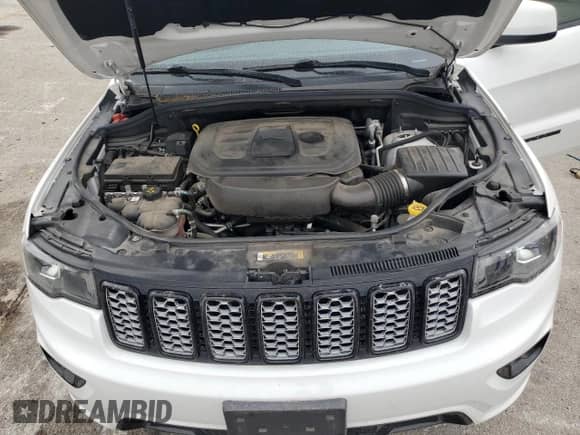 2021 Jeep Grand Cherokee Laredo X with VIN 1C4RJFAG2MC711089, listed as a Copart auction lot 71501015 with 67,511 mi miles and Salvage title. Bid and sale history available at DreamBid. Image 12.