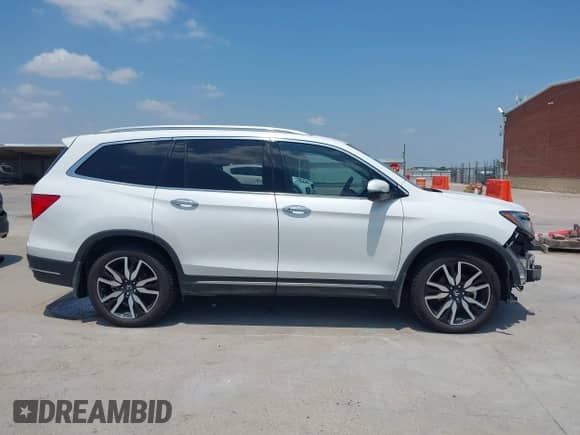 2022 Honda Pilot Elite with VIN 5FNYF6H03NB088592, listed as a IAAI auction lot 42903811 with 55,976 mi miles and . Bid and sale history available at DreamBid. Image 14.