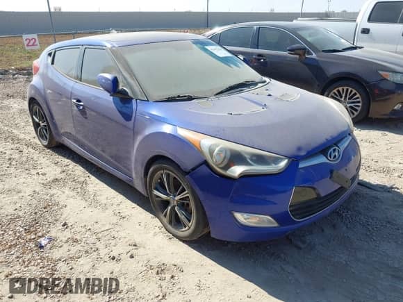 2013 Hyundai Veloster w/Black Int z VIN KMHTC6AD1DU095946, wystawiony jako IAAI lot #43497429 z przebiegiem 148 798 mil mil oraz . Historia ofert i sprzedaży dostępna na DreamBid. Obrazek 1.