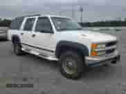 1997 Chevrolet Suburban with VIN 3GNGK26J1VG140914, listed as a Copart auction lot 76651774 with 245,981 mi miles and Salvage title. Bid and sale history available at DreamBid. Image 4.