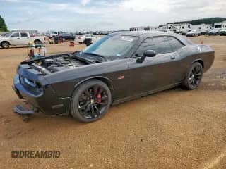 2013 Dodge Challenger SRT-8 with VIN 2C3CDYCJ0DH641692, listed as a Copart auction lot 63022055 with 76,031 mi miles and Salvage title. Bid and sale history available at DreamBid. Image 1.