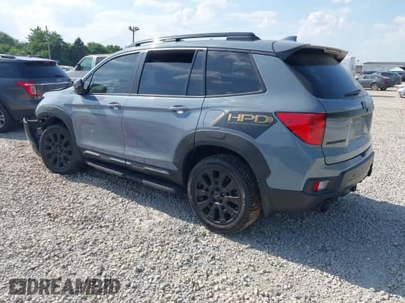 2022 Honda Passport EX-L with VIN 5FNYF8H59NB004976, listed as a IAAI auction lot 42656310 with Not provided miles and . Bid and sale history available at DreamBid. Image 3.