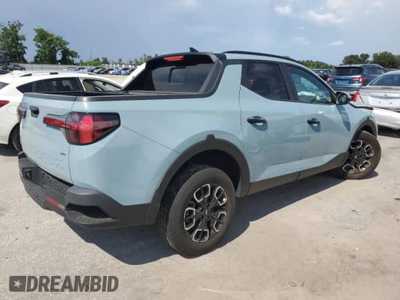 2023 Hyundai Santa Cruz SEL z VIN 5NTJCDAE5PH052204, wystawiony jako Copart lot #69902835 z przebiegiem 16 246 mil mil oraz Nie do naprawy • Non repairable. Historia ofert i sprzedaży dostępna na DreamBid. Obrazek 3.