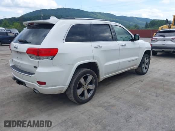 2015 Jeep Grand Cherokee High Altitude z VIN 1C4RJFCM5FC714493, wystawiony jako IAAI lot #42886915 z przebiegiem 180 687 mil mil oraz . Historia ofert i sprzedaży dostępna na DreamBid. Obrazek 4.