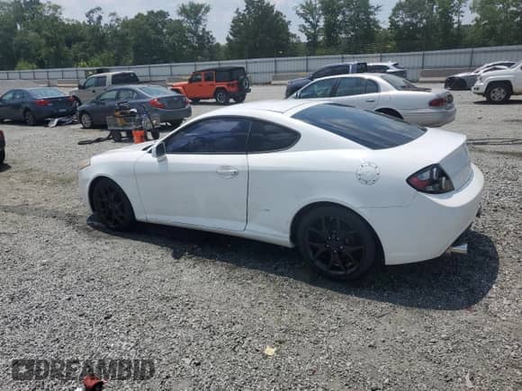2007 Hyundai Tiburon GT с VIN KMHHN66F17U252700, выставлен на аукционе Copart как лот 62289695 с пробегом 96 467 миль миль и Списание • Salvage title. История ставок и продаж доступна на DreamBid. Изображение 2.