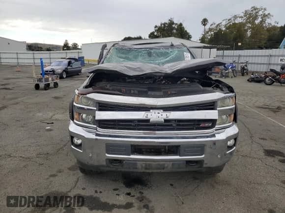 2015 Chevrolet Silverado 2500HD LTZ with VIN 1GC1KWE88FF616678, listed as a Copart auction lot 81795515 with 136,597 mi miles and Salvage title. Bid and sale history available at DreamBid. Image 5.