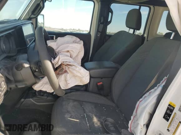 2024 Jeep Wrangler Sport S with VIN 1C4PJXDN7RW243762, listed as a Copart auction lot 77188874 with 18,935 mi miles and Salvage title. Bid and sale history available at DreamBid. Image 7.