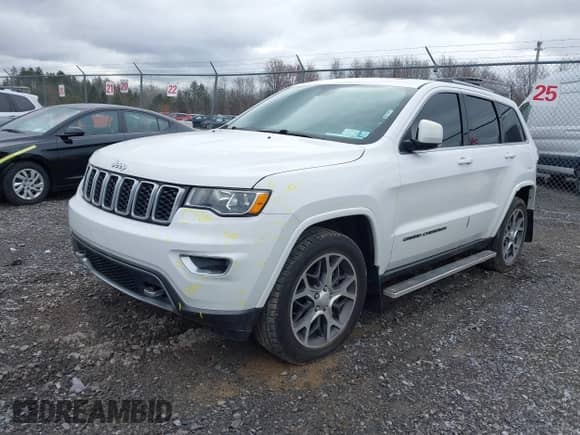 2018 Jeep Grand Cherokee Sterling with VIN 1C4RJFBG7JC263183, listed as a IAAI auction lot 41801205 with 104,301 mi miles and . Bid and sale history available at DreamBid. Image 17.