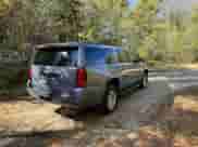 2016 Chevrolet Suburban LT with VIN 1GNSKHKC5GR290564, listed as a Copart auction lot 86899045 with 167,337 mi miles and Salvage title. Bid and sale history available at DreamBid. Image 4.