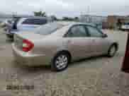 2002 Toyota Camry LE z VIN JTDBE32K920035830, wystawiony jako Copart lot #70140505 z przebiegiem 184 600 mil mil oraz Szkoda całkowita • Salvage title. Historia ofert i sprzedaży dostępna na DreamBid. Obrazek 3.