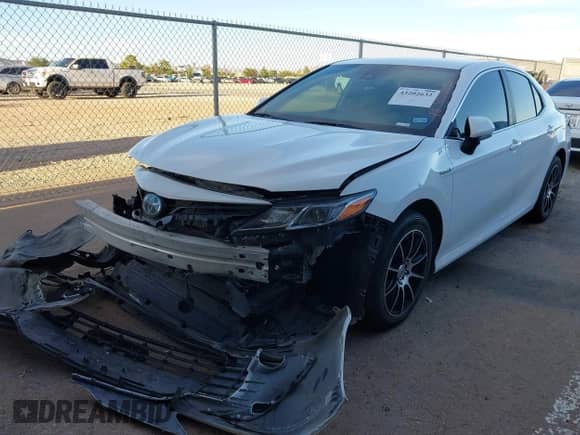 2021 Toyota Camry Hybrid LE with VIN 4T1C31AK3MU560440, listed as a IAAI auction lot 43202632 with 65,038 mi miles and . Bid and sale history available at DreamBid. Image 2.