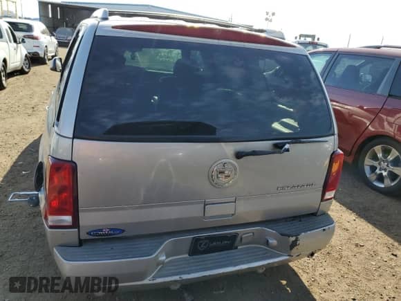 2004 Cadillac Escalade z VIN 1GYEK63N44R216455, wystawiony jako Copart lot #68263243 z przebiegiem 230 087 mil mil oraz Nie do naprawy • Non repairable. Historia ofert i sprzedaży dostępna na DreamBid. Obrazek 6.
