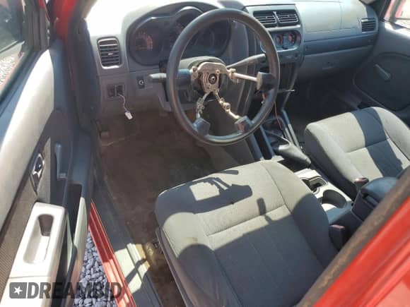 2002 Nissan Frontier XE z VIN 1N6DD26S02C324655, wystawiony jako Copart lot #65977475 z przebiegiem Nie podano mil oraz Czysty tytuł • Clean title. Historia ofert i sprzedaży dostępna na DreamBid. Obrazek 8.