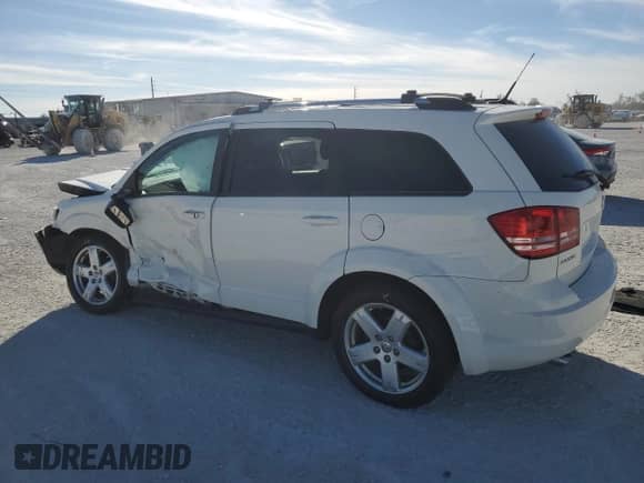2010 Dodge Journey SXT with VIN 3D4PG5FV7AT225310, listed as a Copart auction lot 41499935 with 57,177 mi miles and Salvage title. Bid and sale history available at DreamBid. Image 2.