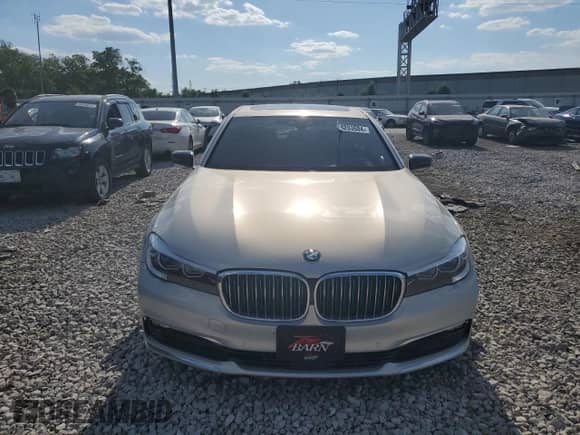 2017 BMW 7 Series 740e xDrive with VIN WBA7J2C3XHG497958, listed as a Copart auction lot 58203604 with 75,256 mi miles and Salvage title. Bid and sale history available at DreamBid. Image 5.