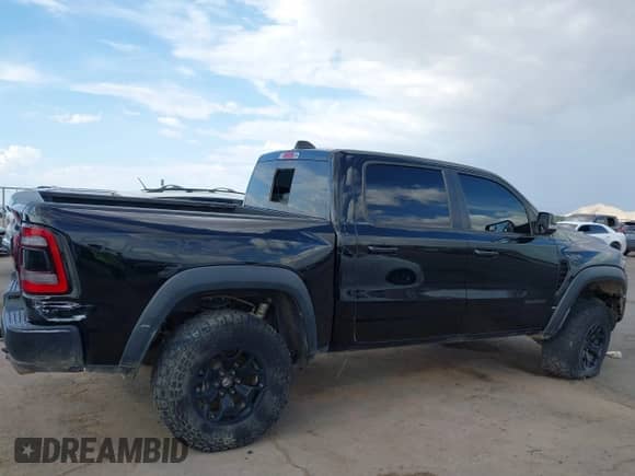 2022 Ram 1500 TRX with VIN 1C6SRFU90NN103186, listed as a IAAI auction lot 42888581 with 53,781 mi miles and . Bid and sale history available at DreamBid. Image 12.