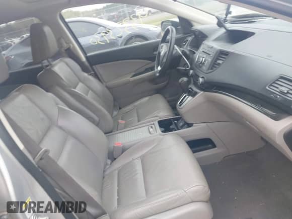 2014 Honda CR-V EX-L with VIN 2HKRM4H72EH609315, listed as a IAAI auction lot 43323930 with 142,569 mi miles and . Bid and sale history available at DreamBid. Image 5.