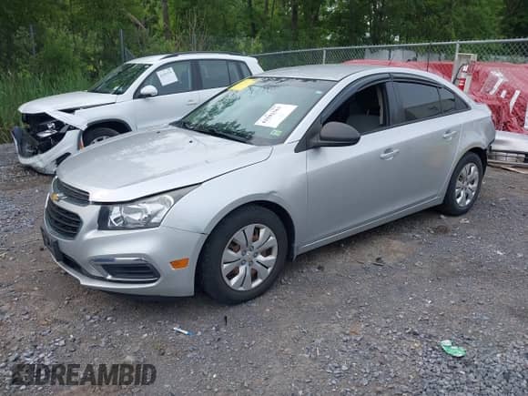 2015 Chevrolet Cruze LS with VIN 1G1PB5SG3F7250969, listed as a IAAI auction lot 42502563 with 90,337 mi miles and . Bid and sale history available at DreamBid. Image 2.