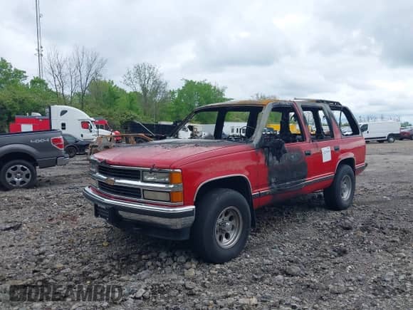 1996 Chevrolet Tahoe with VIN 1GNEK13R5TJ397114, listed as a IAAI auction lot 42254636 with Not provided miles and . Bid and sale history available at DreamBid. Image 2.