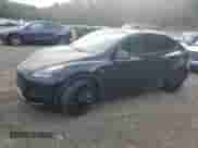 2023 Tesla Model Y Performance with VIN 7SAYGDEF0PF808883, listed as a Copart auction lot 82106605 with 22,706 mi miles and Salvage title. Bid and sale history available at DreamBid. Image 1.