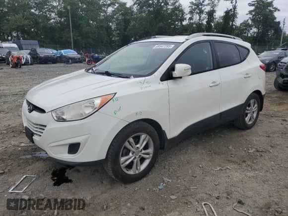 2012 Hyundai Tucson GLS with VIN KM8JUCAC5CU373403, listed as a Copart auction lot 69547285 with 141,239 mi miles and Salvage title. Bid and sale history available at DreamBid. Image 1.