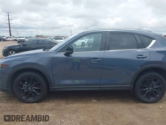 2022 Mazda CX-5 S Preferred z VIN JM3KFBCM8N1581273, wystawiony jako IAAI lot #42568772 z przebiegiem 23 557 mil mil oraz . Historia ofert i sprzedaży dostępna na DreamBid. Obrazek 14.