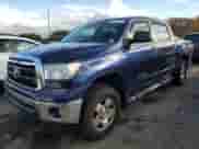 2013 Toyota Tundra with VIN 5TFDY5F17DX283422, listed as a Copart auction lot 82744775 with 216,601 mi miles and Salvage title. Bid and sale history available at DreamBid. Image 1.