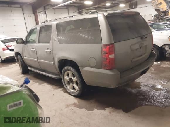 2007 Chevrolet Suburban LTZ with VIN 1GNFK16397J255558, listed as a IAAI auction lot 41804073 with 176,503 mi miles and . Bid and sale history available at DreamBid. Image 3.