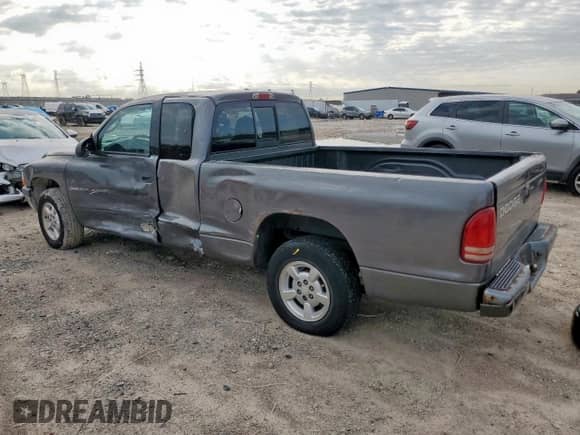 2001 Dodge Dakota z VIN 1B7GL22X91S341785, wystawiony jako Copart lot #90262095 z przebiegiem 164 468 mil mil oraz Szkoda całkowita • Salvage title. Historia ofert i sprzedaży dostępna na DreamBid. Obrazek 2.