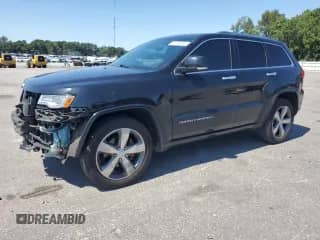 2015 Jeep Grand Cherokee Overland with VIN 1C4RJFCG6FC123955, listed as a Copart auction lot 71092915 with 124,139 mi miles and Salvage title. Bid and sale history available at DreamBid. Image 1.