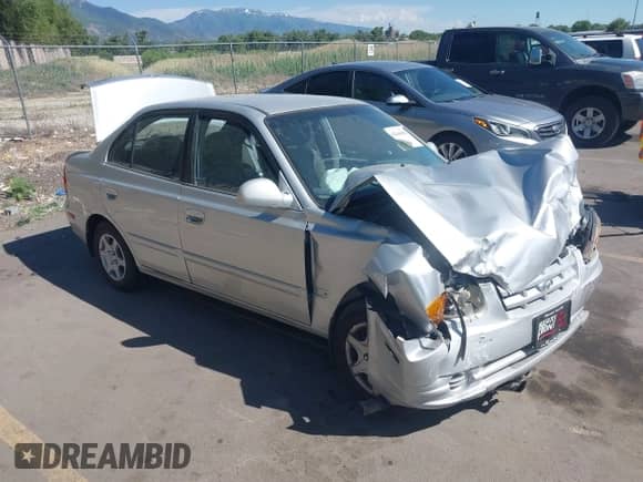 2004 Hyundai Accent GL z VIN KMHCG45C74U567268, wystawiony jako IAAI lot #42444194 z przebiegiem 182 380 mil mil oraz . Historia ofert i sprzedaży dostępna na DreamBid. Obrazek 1.