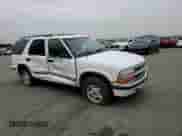 1998 Chevrolet Blazer LT z VIN 1GNDT13W4W2161227, wystawiony jako Copart lot #82557684 z przebiegiem Nie podano mil oraz Szkoda całkowita • Salvage title. Historia ofert i sprzedaży dostępna na DreamBid. Obrazek 11.