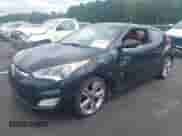 2012 Hyundai Veloster w/Red Int z VIN KMHTC6AD9CU053040, wystawiony jako IAAI lot #43019473 z przebiegiem 119 510 mil mil oraz . Historia ofert i sprzedaży dostępna na DreamBid. Obrazek 2.