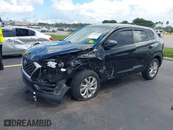 2021 Hyundai Tucson SE with VIN KM8J23A48MU354196, listed as a IAAI auction lot 43189159 with 31,076 mi miles and . Bid and sale history available at DreamBid. Image 2.